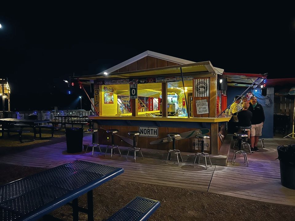 Bobbers Marina Bar lit up at night