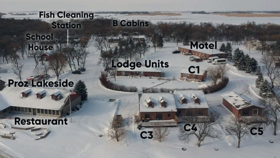 Labeled winter aerial map of Woodland Resort showing Proz Lakeside Restaurant, the fish cleaning station, school house, B cabins, lodge units, motel and cabins C1, C3, C4 and C5